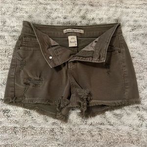 Army green ripped cutoff shorts